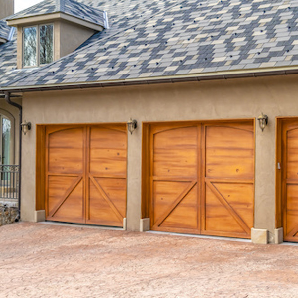brown home with brown garage doors