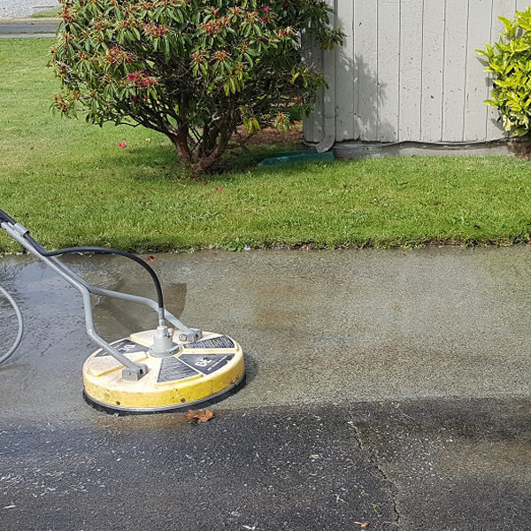 pressure washer on concrete before and after cleaning